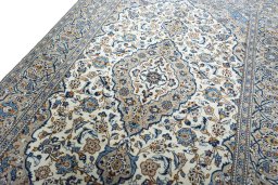 Backside of handmade 2000s Kashan rug showing knot structure and weave density
