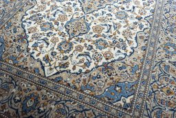 Close-up detail of 2000s Kashan rug from Iran / Persia showing Wool weave