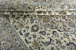 Close-up detail of 2000s Kashan rug from Iran / Persia showing Wool weave