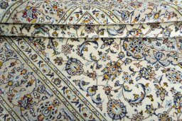 Close-up detail of 2000s Kashan rug from Iran / Persia showing Wool weave