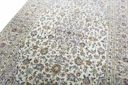 Backside of handmade 2000s Kashan rug showing knot structure and weave density