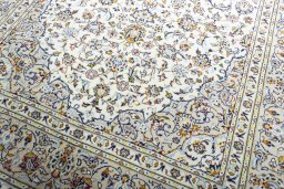 Close-up detail of 2000s Kashan rug from Iran / Persia showing Wool weave