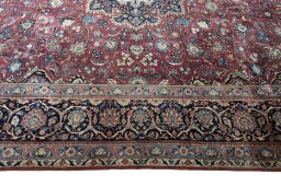 Corner detail of 1930s Kashan rug showing border pattern and Wool pile