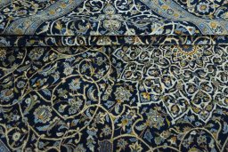 Close-up detail of 2000s Kashan rug from Iran / Persia showing Wool weave
