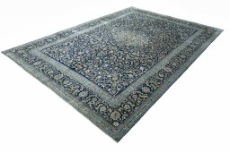 Corner detail of 2000s Kashan rug showing border pattern and Wool pile