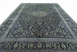 Surface texture of 2000s Kashan rug with natural Wool and intricate pattern