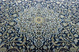 Central medallion detail of 2000s Kashan rug from Iran / Persia