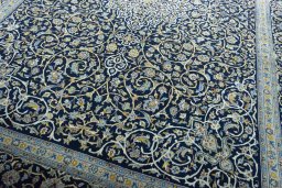 Close-up detail of 2000s Kashan rug from Iran / Persia showing Wool weave