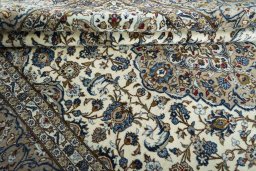 Close-up detail of 2000s Kashan rug from Iran / Persia showing Wool weave