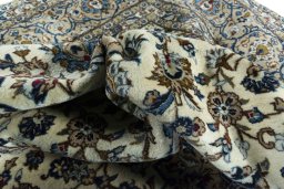 Surface texture of 2000s Kashan rug with natural Wool and intricate pattern