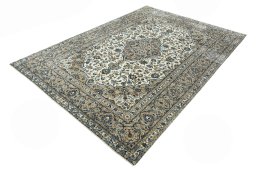 Corner detail of 2000s Kashan rug showing border pattern and Wool pile