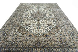 Surface texture of 2000s Kashan rug with natural Wool and intricate pattern