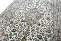 Backside of handmade 2000s Kashan rug showing knot structure and weave density