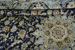 Close-up detail of 2000s Kashan rug from Iran / Persia showing Wool weave