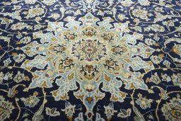 Central medallion detail of 2000s Kashan rug from Iran / Persia