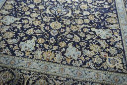Close-up detail of 2000s Kashan rug from Iran / Persia showing Wool weave
