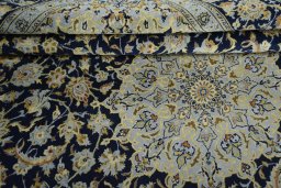 Surface texture of 2000s Kashan rug with natural Wool and intricate pattern