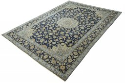 Corner detail of 2000s Kashan rug showing border pattern and Wool pile