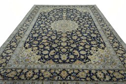 Surface texture of 2000s Kashan rug with natural Wool and intricate pattern