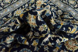 Surface texture of 2000s Kashan rug with natural Wool and intricate pattern