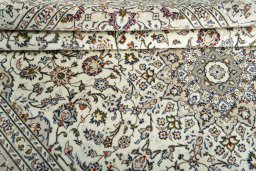 Close-up detail of 2000s Kashan rug from Iran / Persia showing Wool weave
