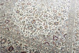 Close-up detail of 2000s Kashan rug from Iran / Persia showing Wool weave