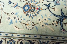 Close-up detail of 2000s Kashan rug from Iran / Persia showing Wool weave