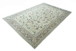 Corner detail of 2000s Kashan rug showing border pattern and Wool pile