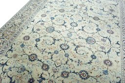 Backside of handmade 2000s Kashan rug showing knot structure and weave density