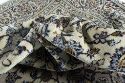Surface texture of 2000s Kashan rug with natural Wool and intricate pattern