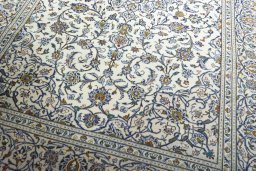 Close-up detail of 2000s Kashan rug from Iran / Persia showing Wool weave