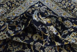 Surface texture of 2000s Kashan rug with natural Wool and intricate pattern