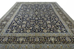 Surface texture of 2000s Kashan rug with natural Wool and intricate pattern