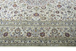 Corner detail of 2000s Kashan rug showing border pattern and Wool pile