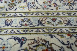 Close-up detail of 2000s Kashan rug from Iran / Persia showing Wool weave