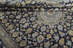 Close-up detail of 2000s Kashan rug from Iran / Persia showing Wool weave