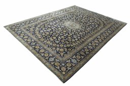 Corner detail of 2000s Kashan rug showing border pattern and Wool pile