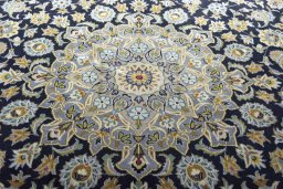 Central medallion detail of 2000s Kashan rug from Iran / Persia
