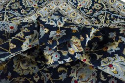 Surface texture of 2000s Kashan rug with natural Wool and intricate pattern