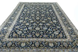 Surface texture of 2000s Kashan rug with natural Wool and intricate pattern