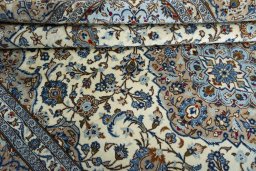 Close-up detail of 2000s Kashan rug from Iran / Persia showing Wool weave