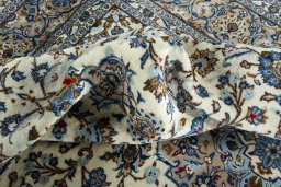 Surface texture of 2000s Kashan rug with natural Wool and intricate pattern