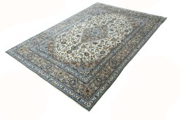 Corner detail of 2000s Kashan rug showing border pattern and Wool pile