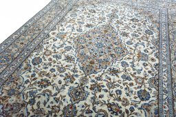 Backside of handmade 2000s Kashan rug showing knot structure and weave density