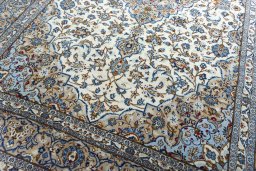 Close-up detail of 2000s Kashan rug from Iran / Persia showing Wool weave