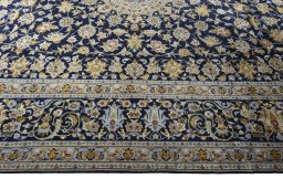 Corner detail of 2000s Kashan rug showing border pattern and Wool pile