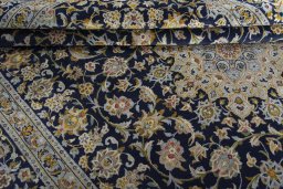 Close-up detail of 2000s Kashan rug from Iran / Persia showing Wool weave