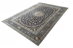 Corner detail of 2000s Kashan rug showing border pattern and Wool pile