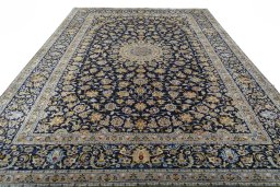 Surface texture of 2000s Kashan rug with natural Wool and intricate pattern