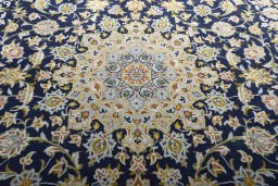 Central medallion detail of 2000s Kashan rug from Iran / Persia